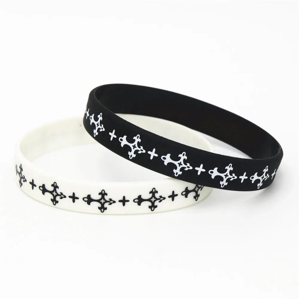 Black silicone cross wristband with white decorative stitching on a white background.