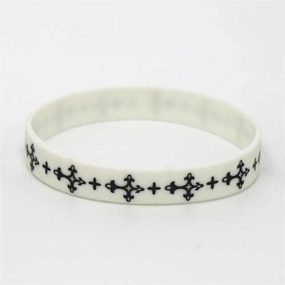 White silicone cross wristband with black etched crosses for sports and fashion