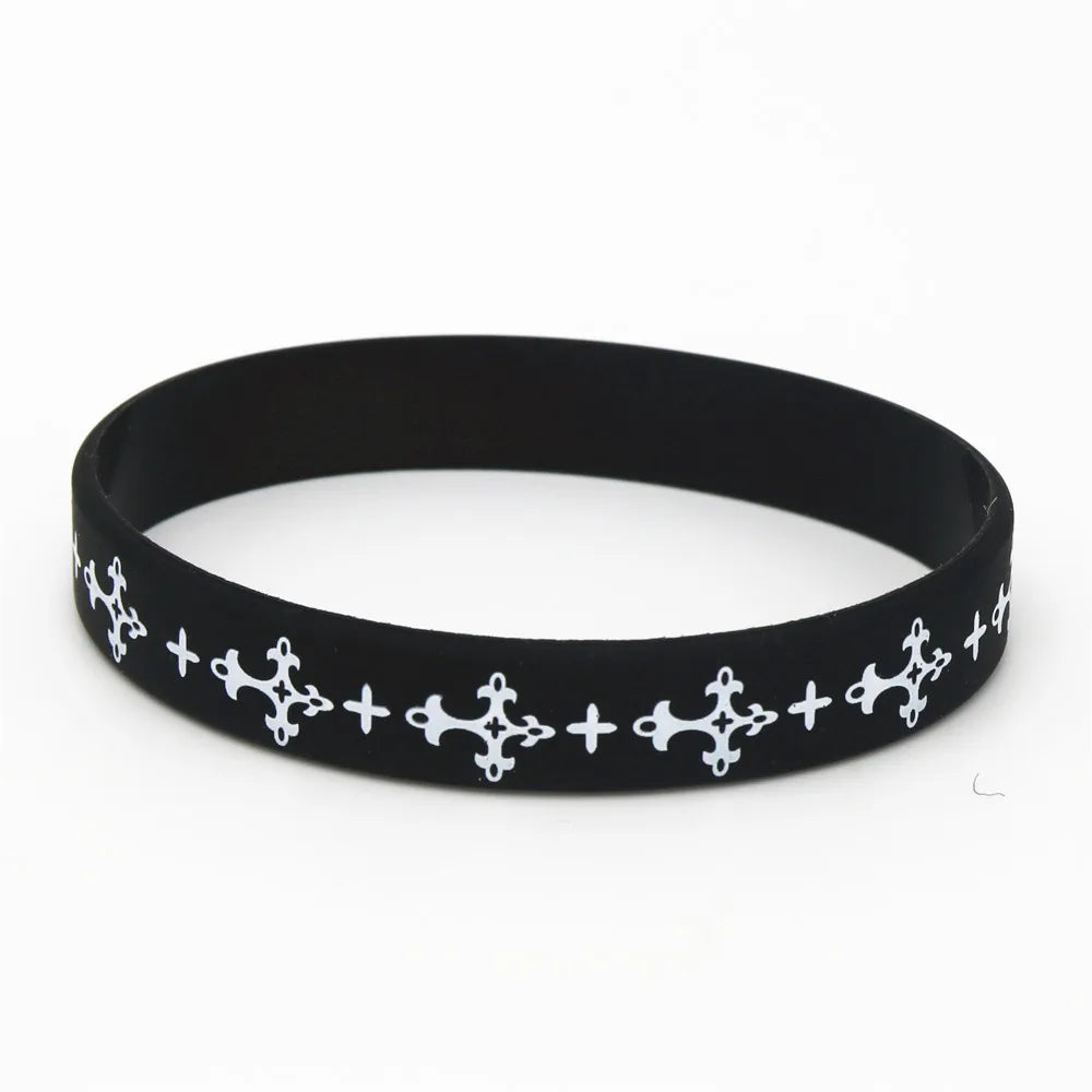 Black silicone cross wristband with white decorative crosses.