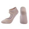 A pair of beige breathable women's Pilates and yoga socks shown from the side.