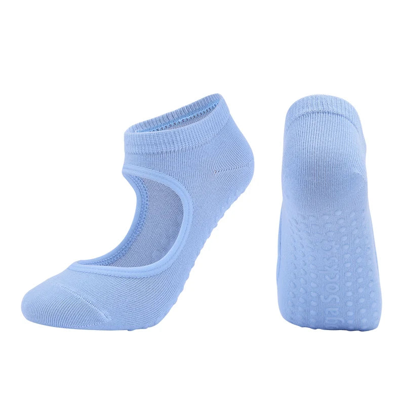 A pair of light blue breathable women's Pilates and yoga socks, shown from the side.