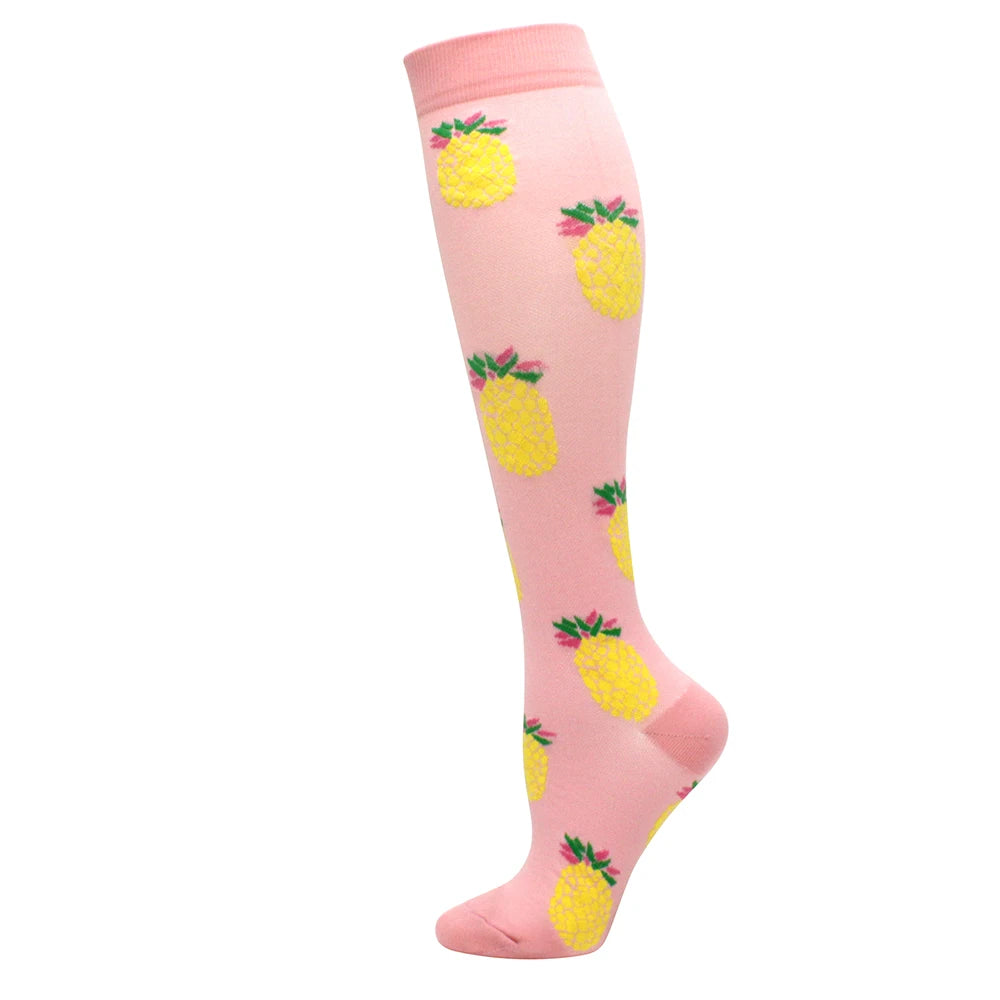 Pink compression socks with yellow fruit designs for circulation and vein support