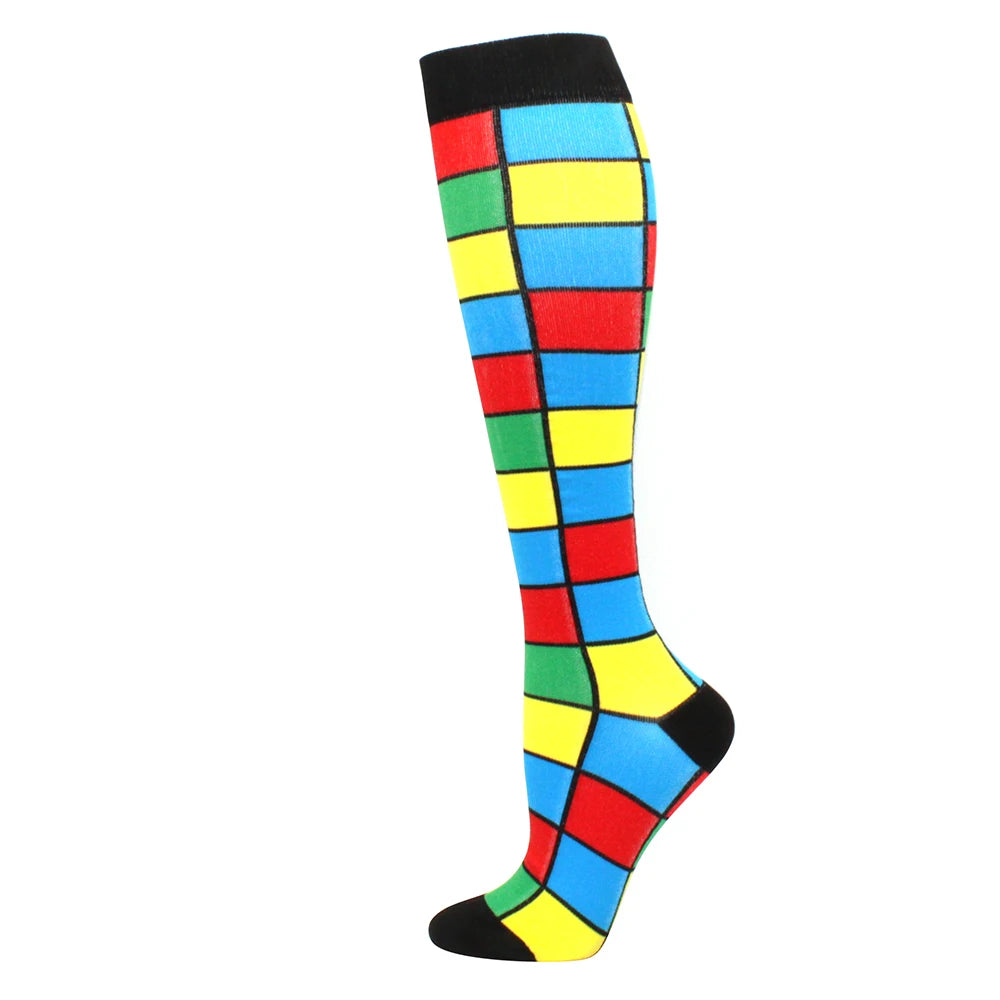 A pair of black and multi-colored compression socks with a checkered pattern.