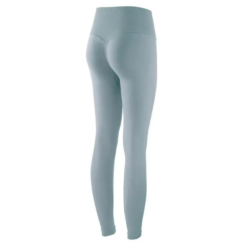 Light blue high-waist seamless yoga leggings shown from the back.