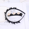 Black double layer headband decorated with pearl and rhinestone accents for a wedding