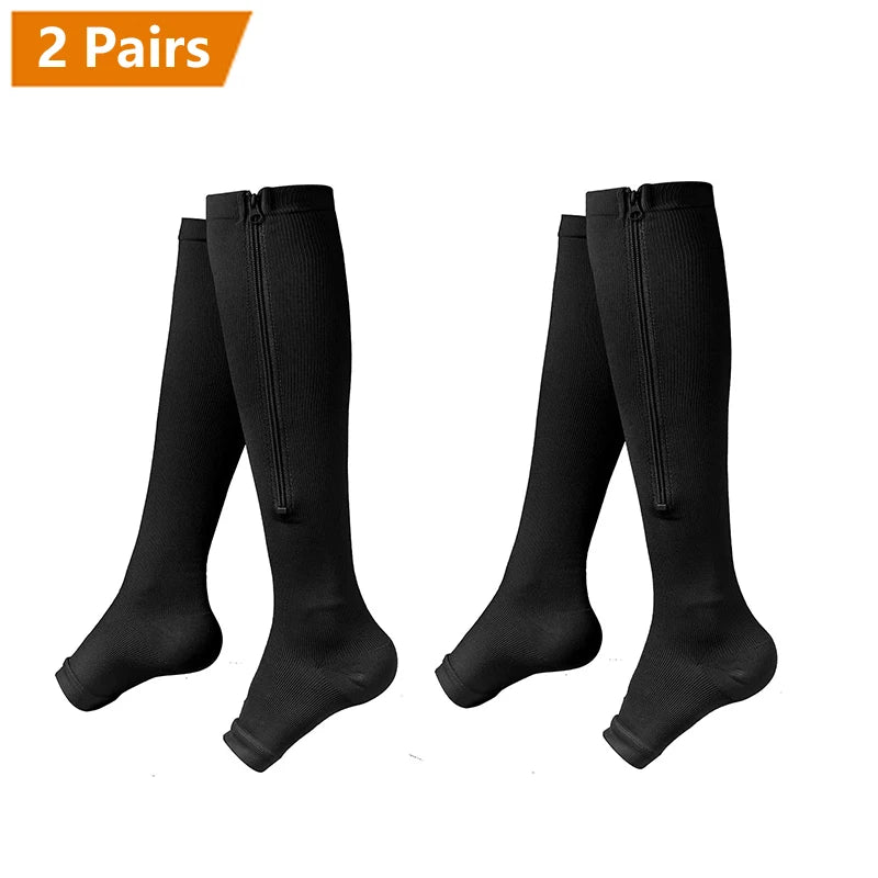 Two pairs of black zipper compression socks displayed flat.