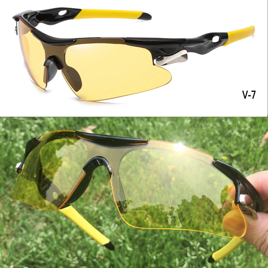 A pair of yellow-framed sunglasses with amber lenses shown in a close-up outdoors.