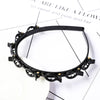 Black double layer headband decorated with small pearl and rhinestone embellishments