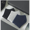 A display of three pairs of women's thin cotton no-show socks in black, light gray, and navy blue.