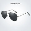Black polarized pilot sunglasses shown against a white background.