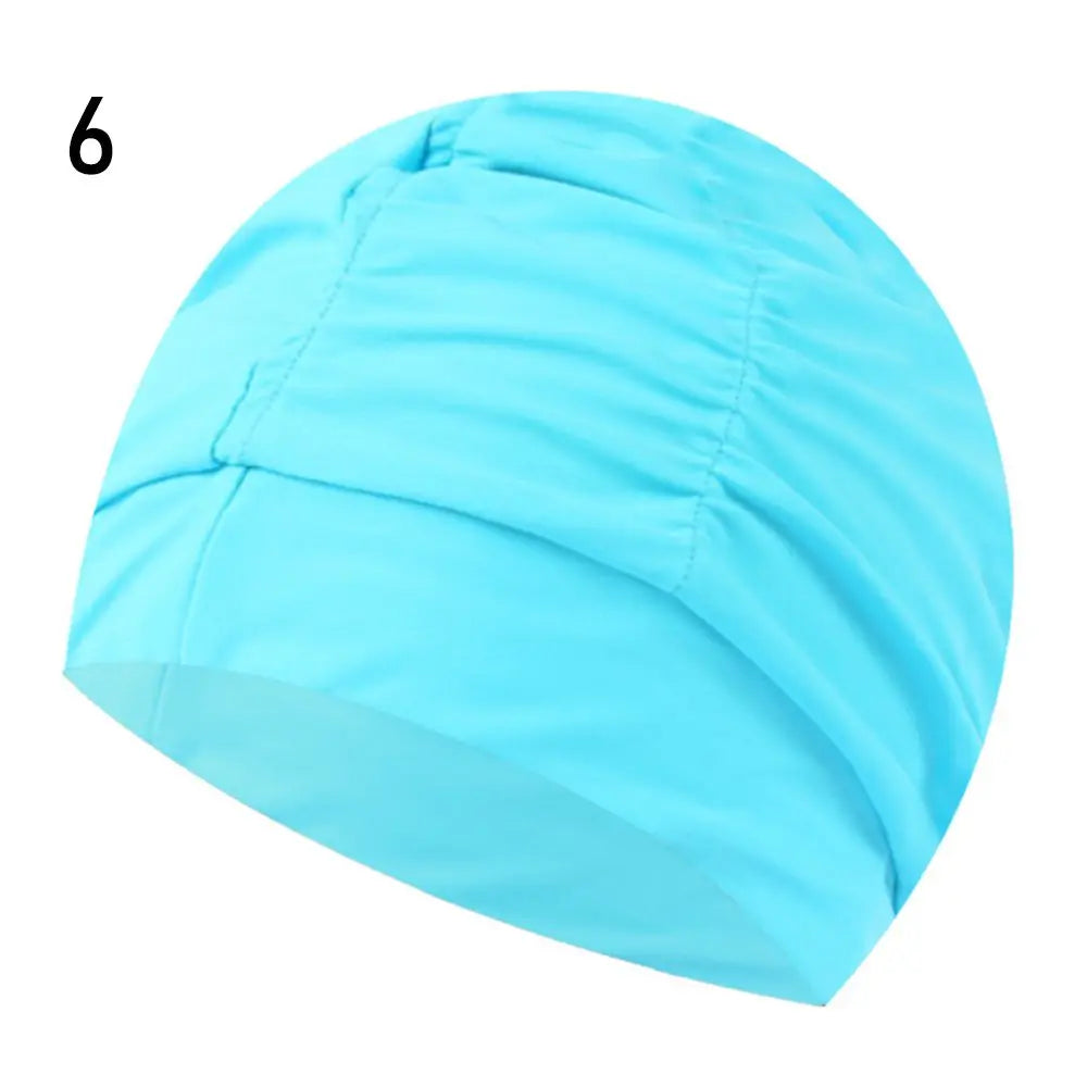 Light blue elastic nylon turban swimming cap shown from the side.