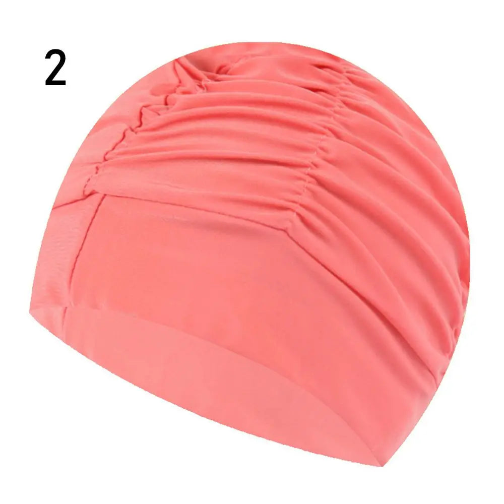 A pink elastic nylon turban swimming cap shown from the side.