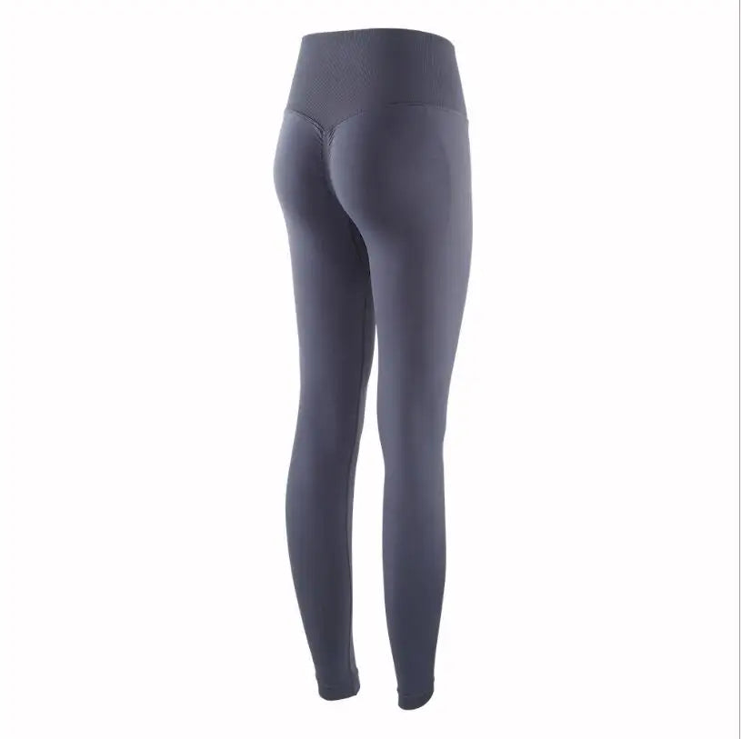 A full view of a dark gray high-waist seamless yoga legging.