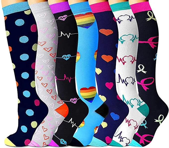 A set of colorful compression elastic socks featuring various heart and rainbow patterns.