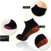 Chaussettes de compression noires avec détails en fibre de cuivre et pointe effilée.