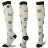 A set of multi-color compression socks featuring various animal designs on a light background.