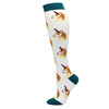 White compression socks with orange and brown animal designs and teal trim