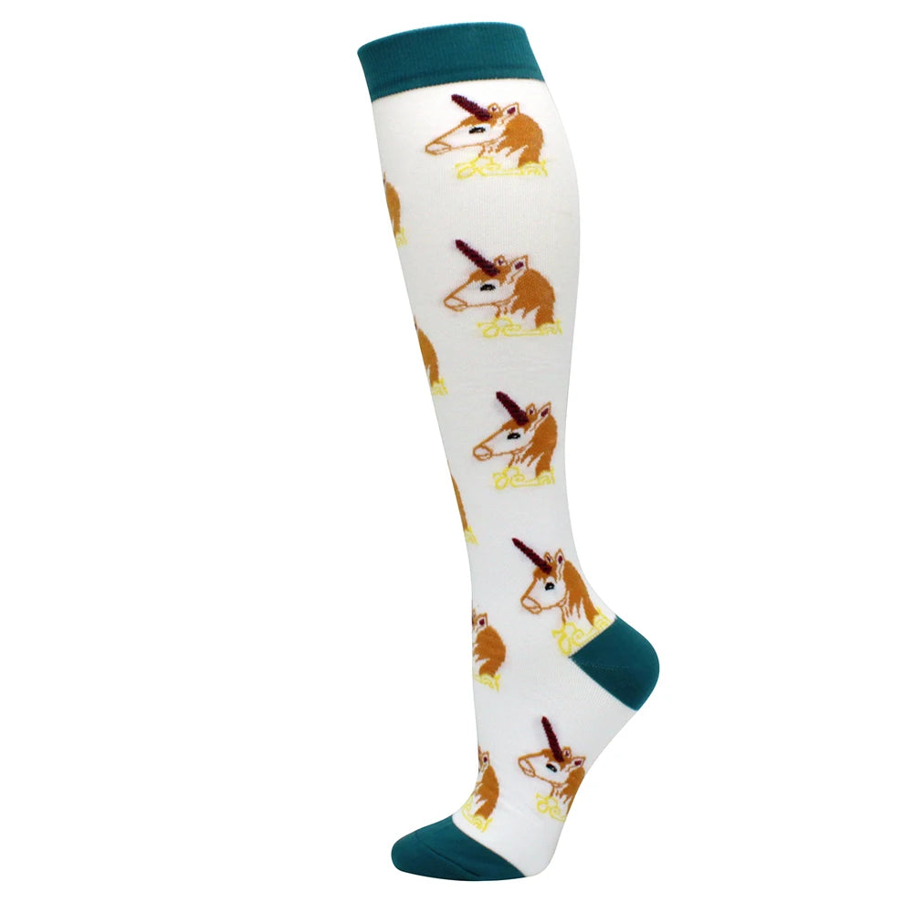 White compression socks with orange and brown animal designs and teal trim