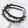 Black double layer headband adorned with small pearls and rhinestones