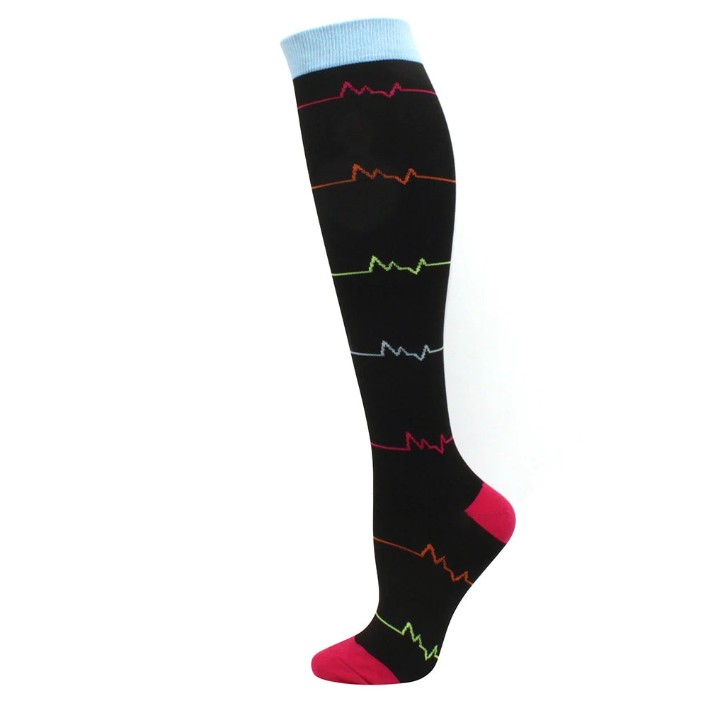 Black compression socks with colored ECG-like lines and a blue cuff.