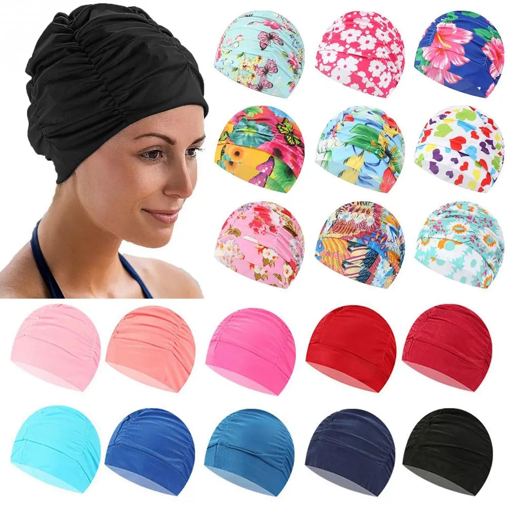 A variety of colorful elastic nylon turban swimming caps in pink, red, blue, and black are shown on a model's head.