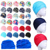 A collection of blue and pink elastic nylon turban swimming caps for various sizes and styles.