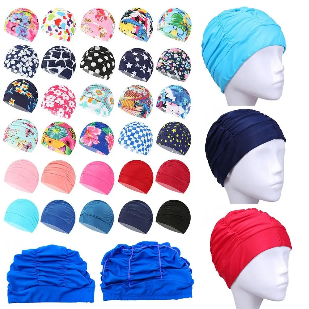 A collection of blue and pink elastic nylon turban swimming caps for various sizes and styles.