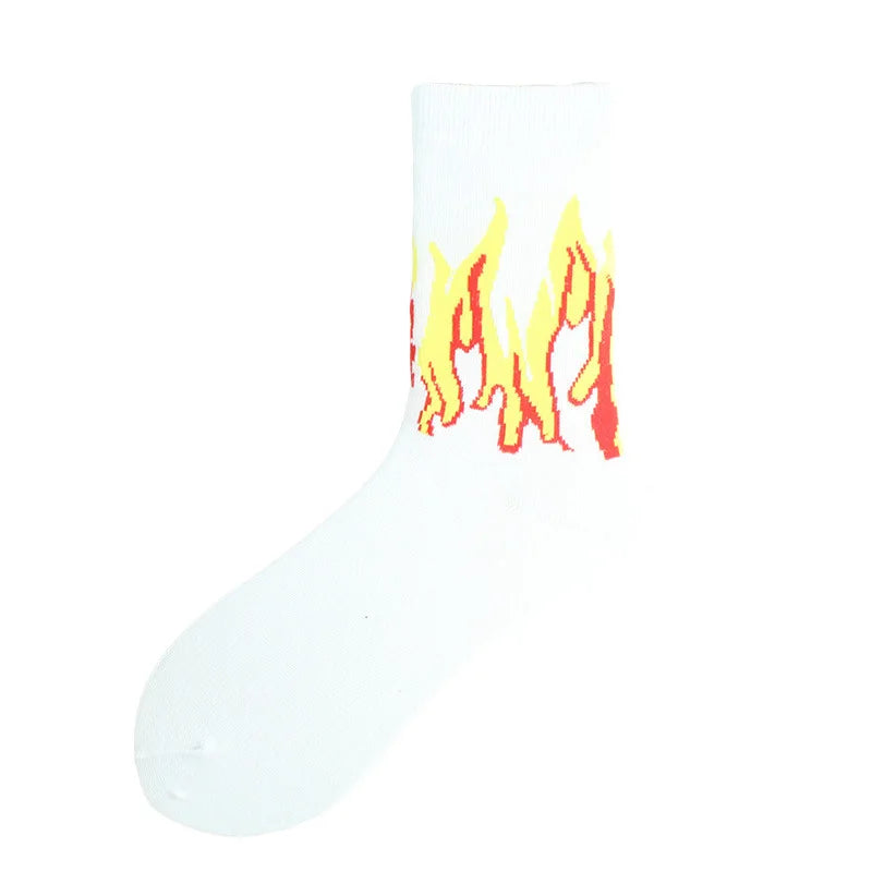 White crew socks featuring a flame pattern in yellow and orange colors.