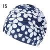 A navy blue and white patterned elastic nylon turban swimming cap shown from the side.