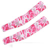 A pair of pink and gray camouflage tactical arm sleeves stretched out.