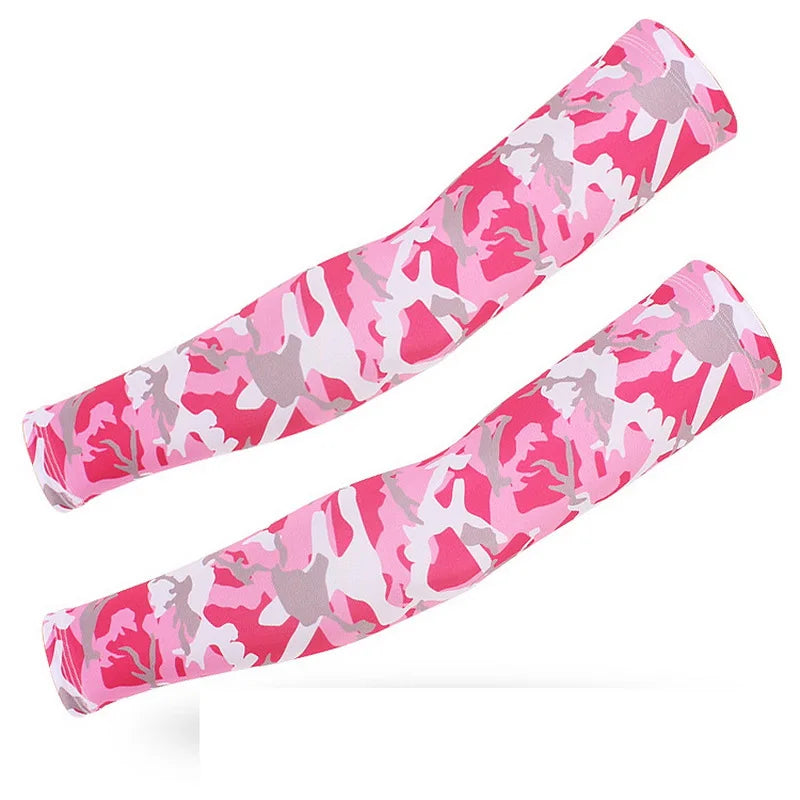 A pair of pink and gray camouflage tactical arm sleeves stretched out.