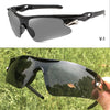 A pair of black sport sunglasses resting on a hand, reflecting greenery.