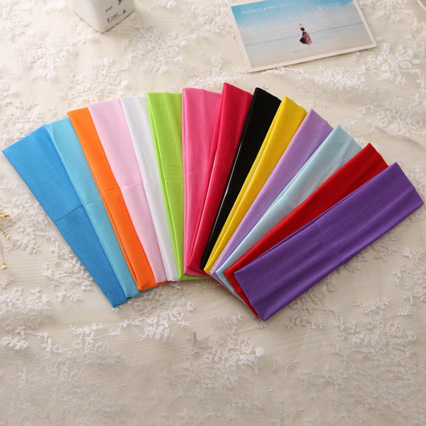 Une exposition colorée de bandeaux élastiques multi-usages dans diverses nuances : bleu, orange, rose, vert, jaune et violet.