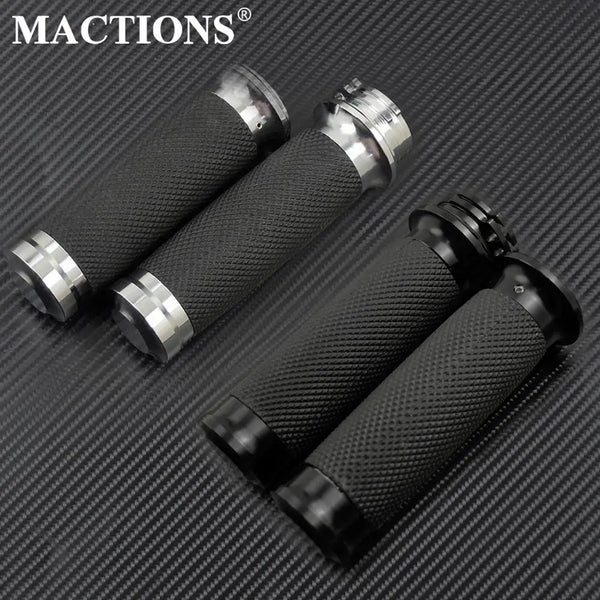 A set of black and silver motorcycle handlebar grips for Harley Touring and Sportster motorcycles.