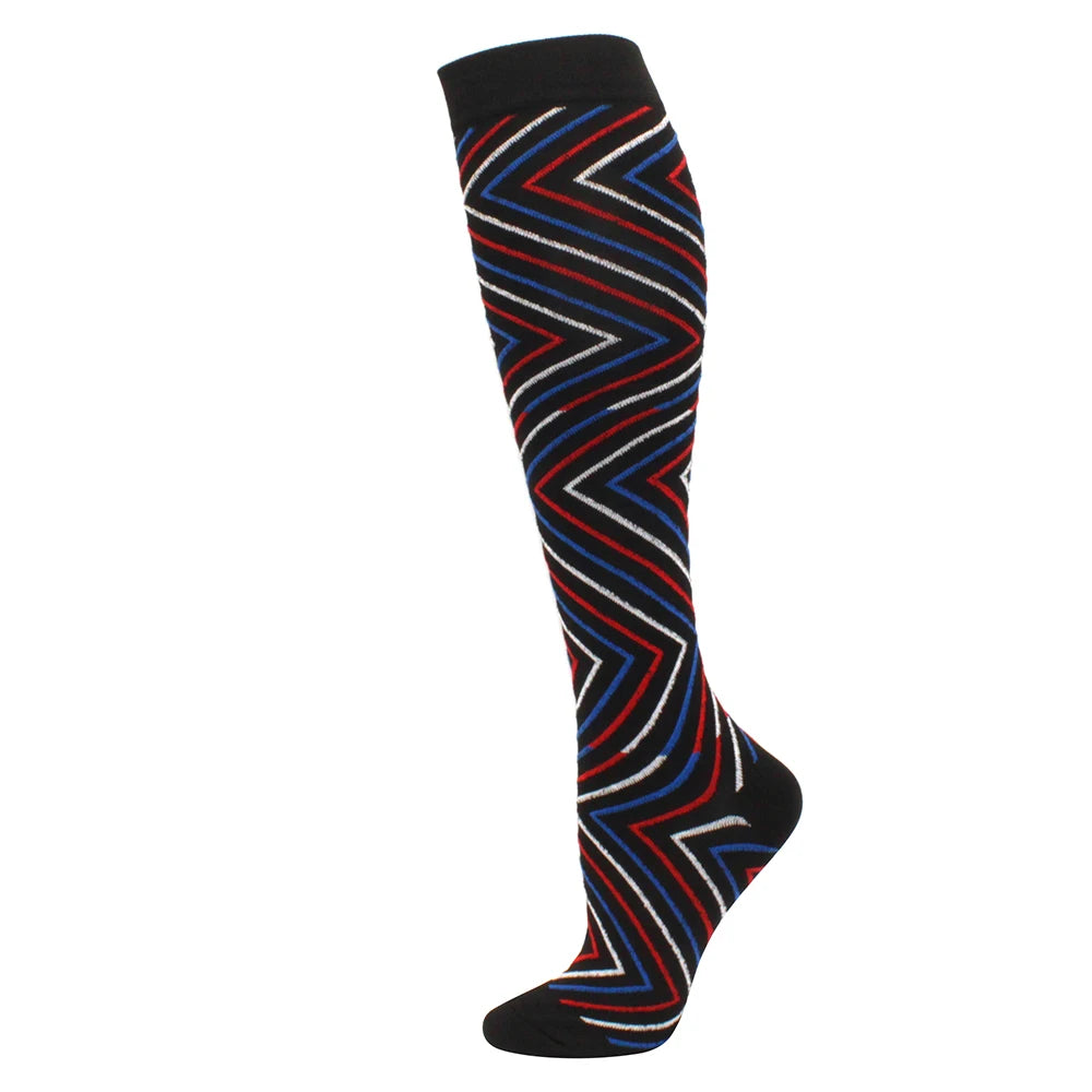 Black compression socks with a geometric pattern of red and blue stripes