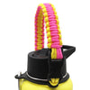 A yellow water bottle with a pink and yellow paracord strap attached.