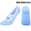 Pair of light blue breathable women's Pilates and yoga socks shown from the side.