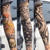 Close-up of a person wearing dark grey UV protection tattoo arm sleeves with intricate black and grey designs.