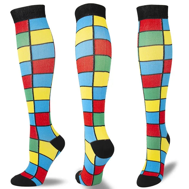 A set of multi-color compression socks featuring a grid pattern in red, blue, yellow, and green.