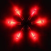 A set of lighted arrow nocks for archery, glowing bright red against a dark background.