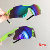 A pair of neon green sport sunglasses with iridescent purple and blue lenses being held by a hand.