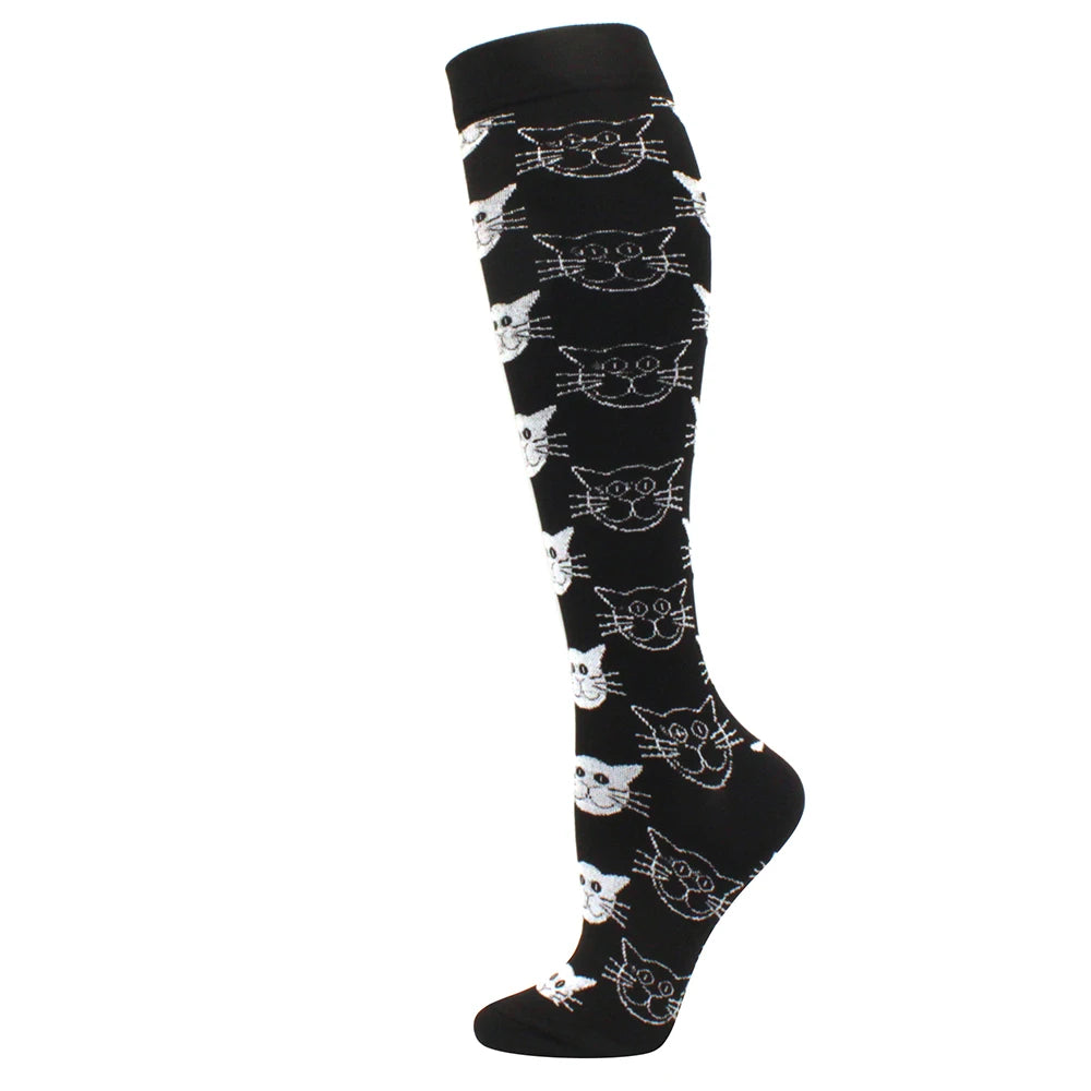 Black compression socks featuring a repeating pattern of stylized cats.