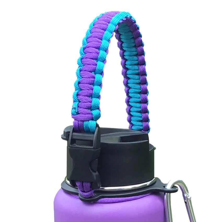 Purple paracord strap attached to a black bottle, used for hiking and travel.