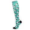 A pair of teal compression socks featuring a repeating pattern of black and white dog faces.