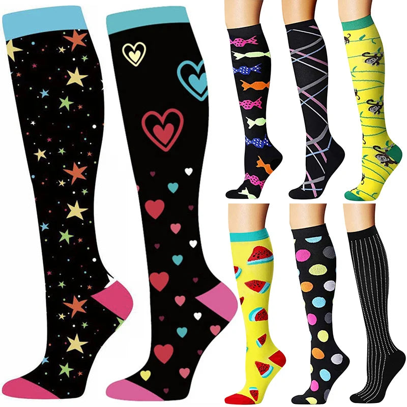A set of black compression socks decorated with various heart and animal patterns in pink, green, and yellow.
