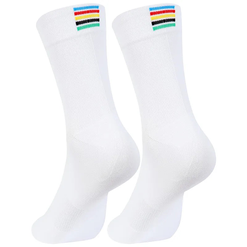 A pair of white performance cycling and sports socks with colorful stripes at the top.
