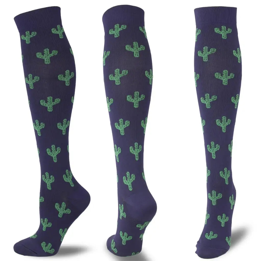 A pair of dark purple compression socks patterned with green cacti.