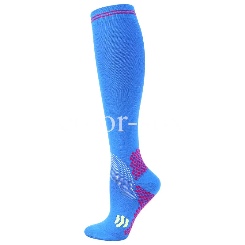A blue graduated compression sock with red stitching and a yellow logo on the toe.