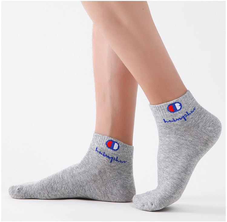 Gray ankle socks with a blue logo featuring the word hemphu