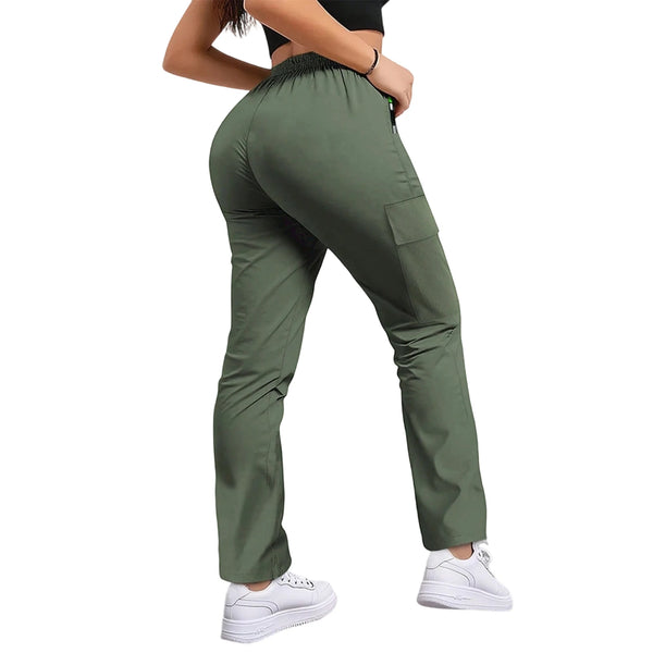 A woman wearing olive green drawstring cargo pants and a black top, viewed from the side.